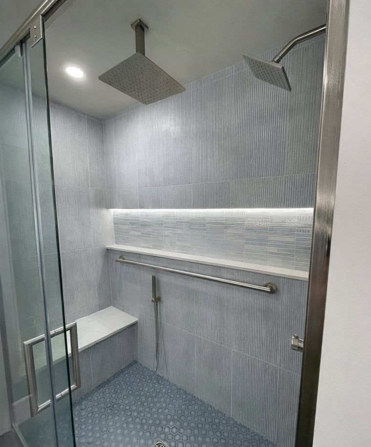 After: a walk-in shower with a bench, grab bar and lit niche
